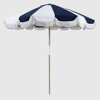Mentari Market Umbrella in Dark Navy and oat panels with white fringe
