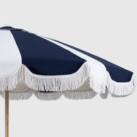 Dark Navy and oat Mentari canopy with white fringe, angled close-up