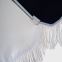 Underside of the Mentari Market Umbrella in Dark Navy, showing the rib tip and fringe