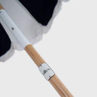 Silux badge and rib detail on the Mentari Market Umbrella in Dark Navy