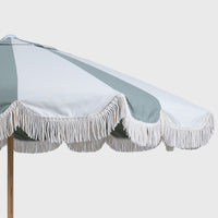 Sage and oat Mentari canopy with white fringe, angled close-up