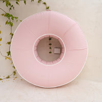 Pink Halo Float V2 standing upright against a white wall