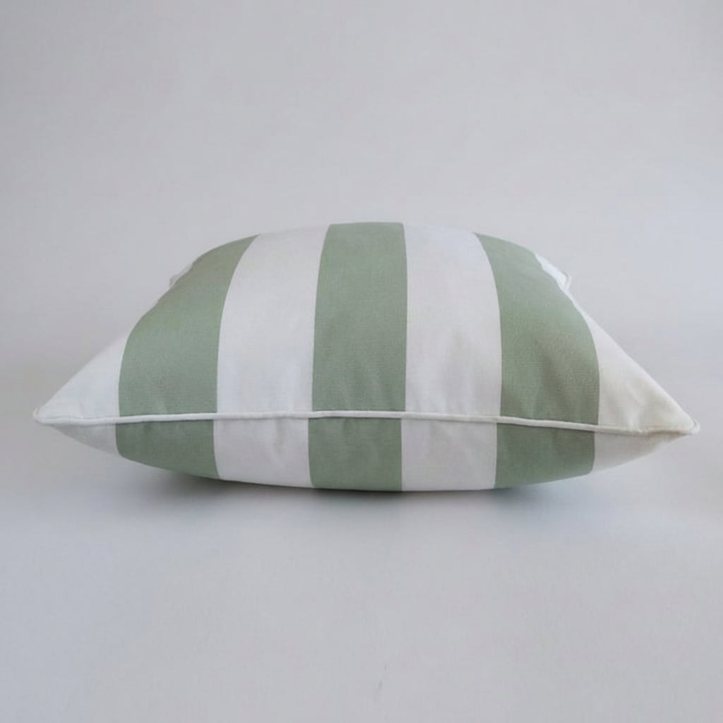 Sage stripe Outdoor Pillow shown at angle — coastal poolside cushion